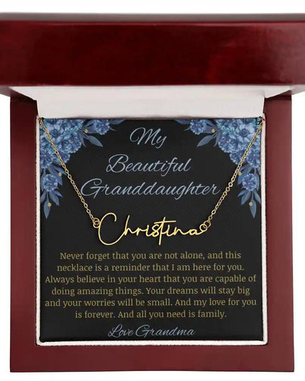 Signature Name Necklace with a yellow gold finish on a to my beautiful granddaughter from grandma greeting card in a mahogany box up close