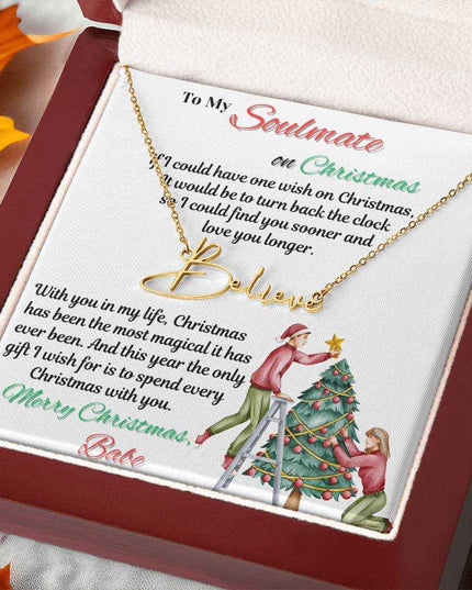 yellow gold signature name necklace in a luxury box angled to the right
