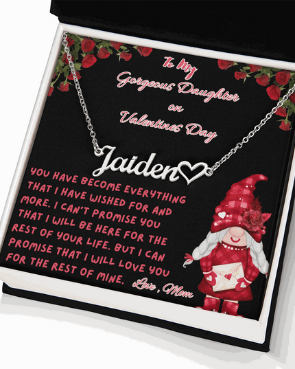 polished stainless-steel name heart necklace in a soft box angled right