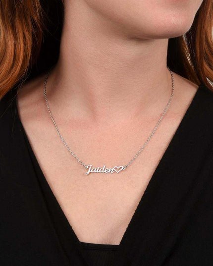 polished stainless-steel name heart necklace on a model's neck