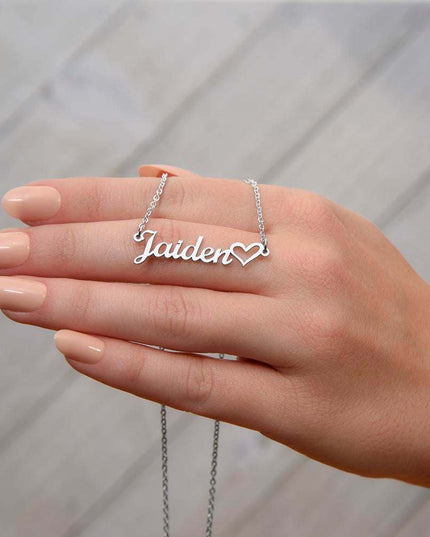 polished stainless steel name heart necklace on model's hand