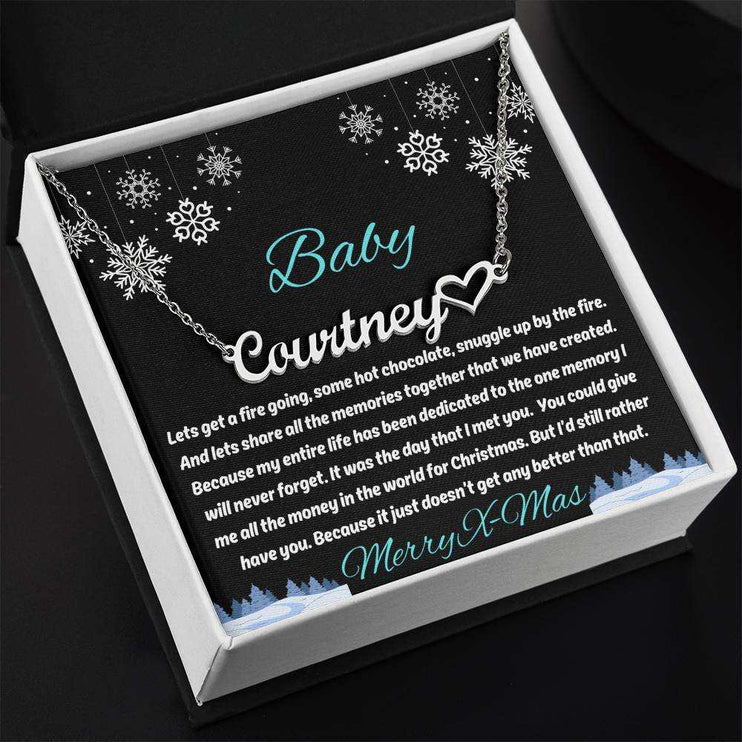 stainless-steel name heart necklace in soft box up close angled left