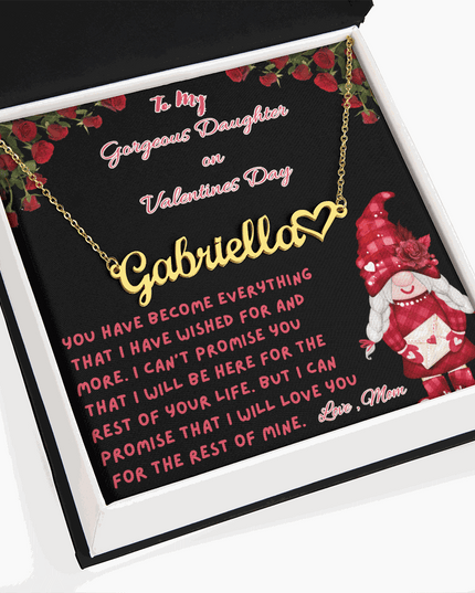 yellow gold name heart necklace in a soft box angled to the left