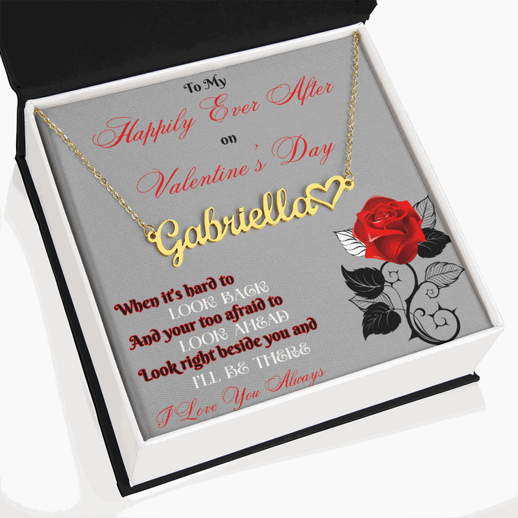gold name heart necklace in soft box angled to the left