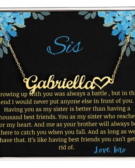 Name Heart Necklace with a yellow gold finish charm with a to sis from bro greeting card up close