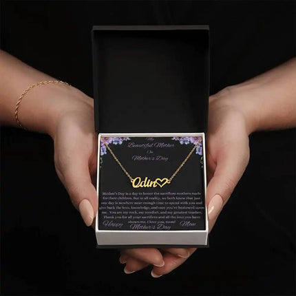 yellow gold name heart necklace in models hands