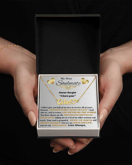 18k name heart necklace in soft box in hands