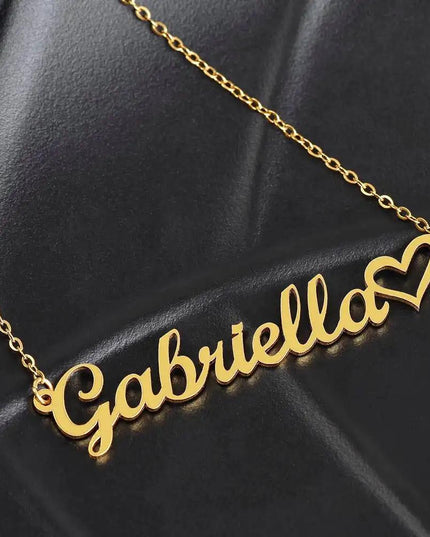 gold name heart necklace on black leather