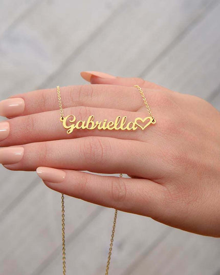 18k name heart necklace on model's hand