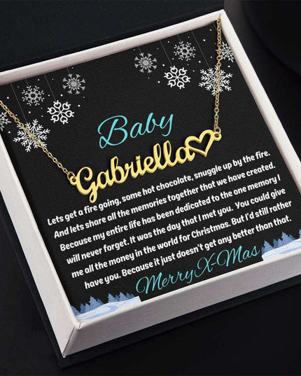 gold name heart necklace in soft box angled to left