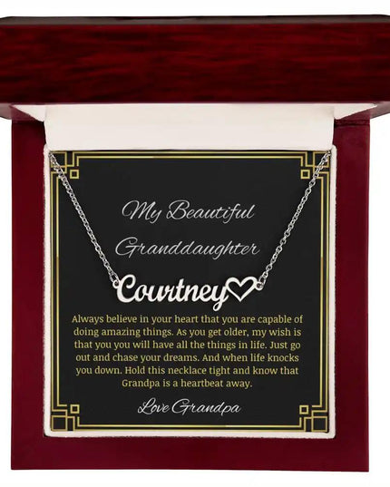 Name Heart Necklace with a polished stainless-steel charm on a to granddaughter from grandpa greeting card in a mahogany box 