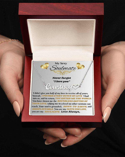 polished stainless-steel name heart necklace in luxury box in hands