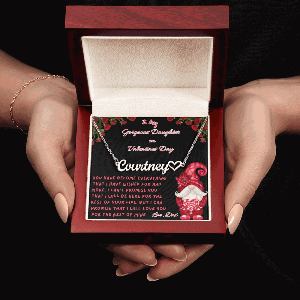 polished stainless-steel name heart necklace in a luxury box in a model's hands