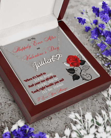 stainless steel name heart necklace in a mahogany box angled to the left