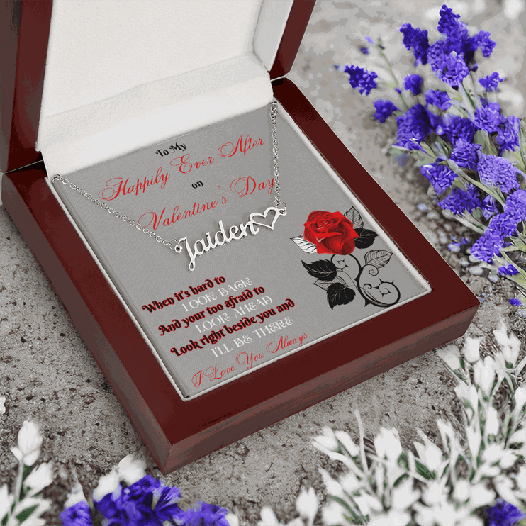 stainless steel name heart necklace in a mahogany box angled to the left