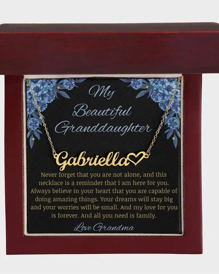 Name Heart Necklace with a yellow gold finish charm on a to granddaughter from grandma greeting card in a mahogany box
