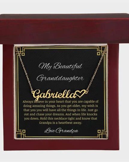 Name Heart Necklace with a yellow gold finish charm on a to granddaughter from grandpa greeting card in a mahogany box
