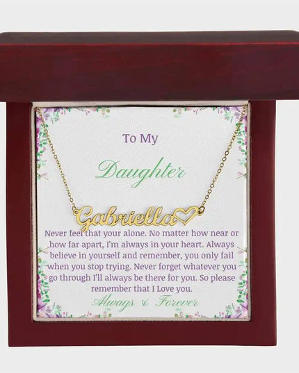 A yellow gold name heart necklace in a mahogany box 