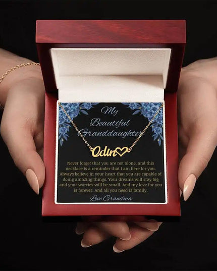 ish charm on a to granddaughter from grandma greeting card in a mahogany box in a models hands