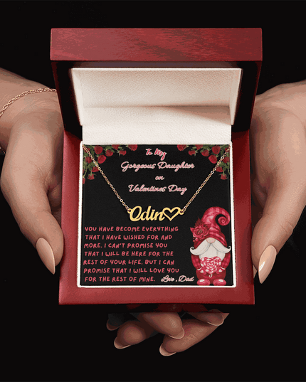 yellow gold name heart necklace in a luxury box in a model's hands
