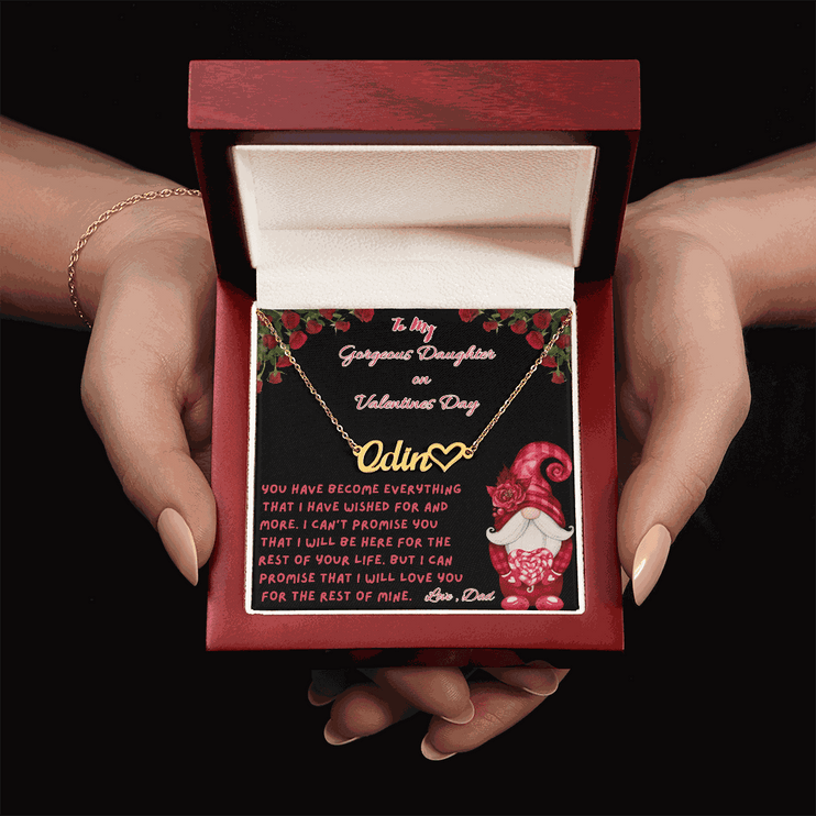 yellow gold name heart necklace in a luxury box in a model's hands