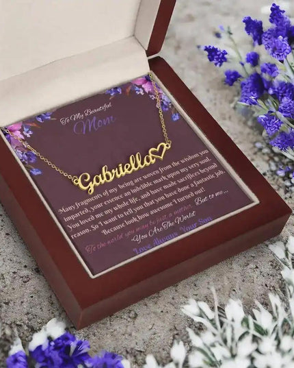 gold name heart necklace in mahogany box angled left