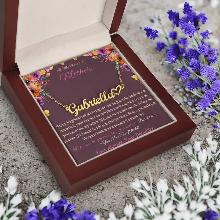 gold name heart necklace in mahogany box angled left