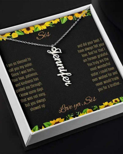 Vertical Name Necklace with a polished stainless-steel finish on a To Sis From Sis greeting card close up angled slightly right