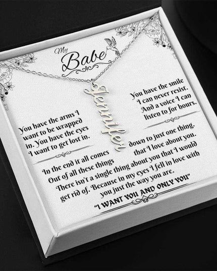polished stainless-steel vertical name necklace in a soft box angled left