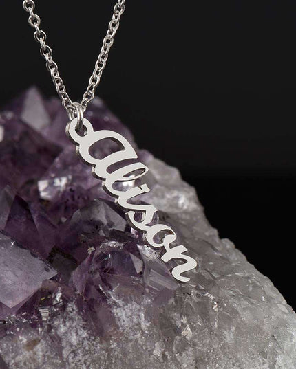 polished stainless-steel vertical name necklace on a geode rock