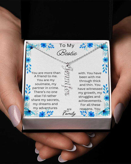 vertical name necklace in standard box with to my bestie message card silver variant photo of hands holding box