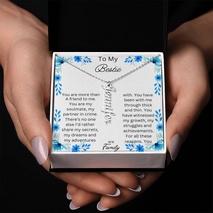 vertical name necklace in standard box with to my bestie message card silver variant photo of hands holding box