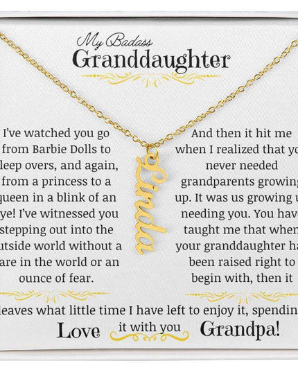 a yellow gold vertical name necklace up close.