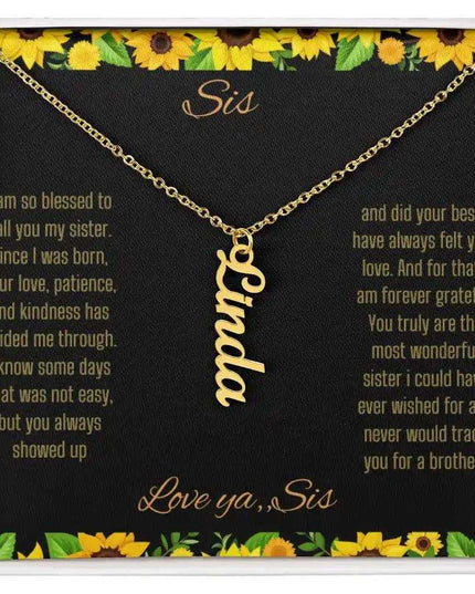 Vertical Name Necklace with a yellow gold finish on a To Sis From Sis greeting card close up