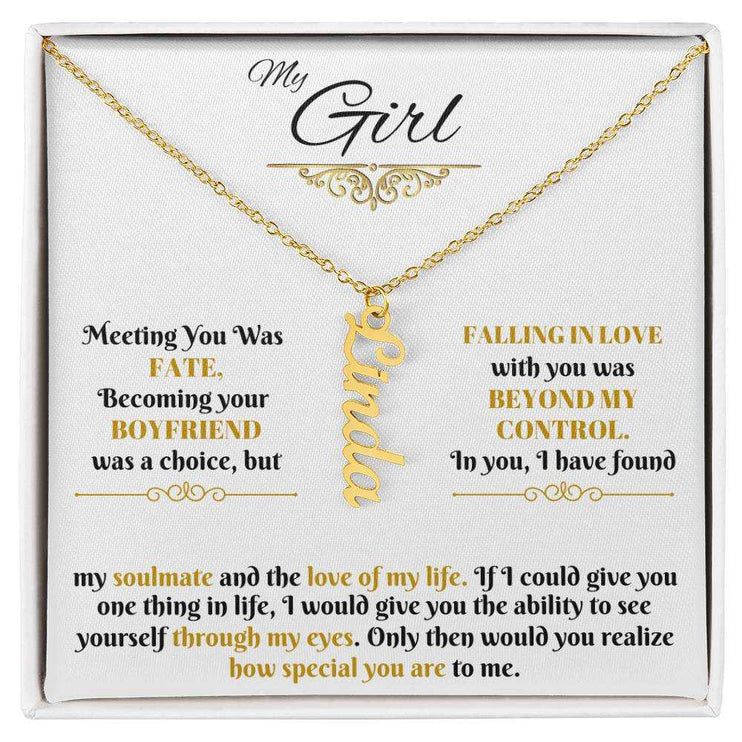 gold vertical name necklace in a soft box up close