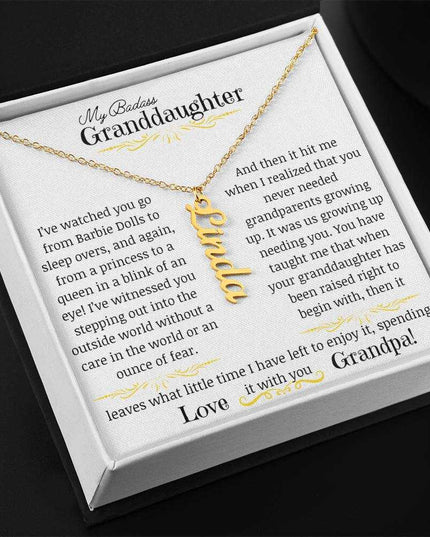 a yellow gold vertical name necklace angled left.