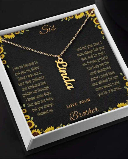 Vertical Name Necklace with a yellow gold finish charm on a to sis from brother greeting card in a two-tone box angled slightly to the right