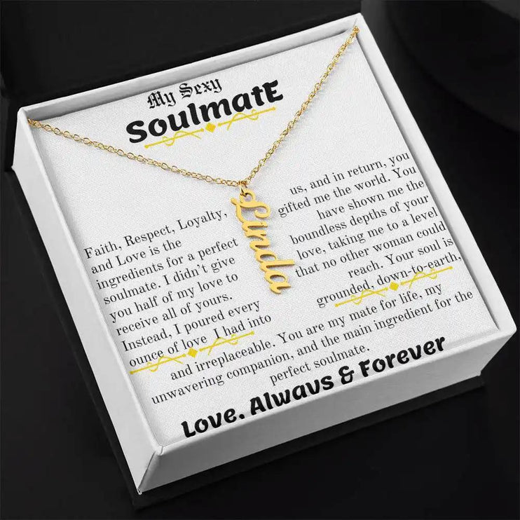 a yellow gold vertical name necklace angled left