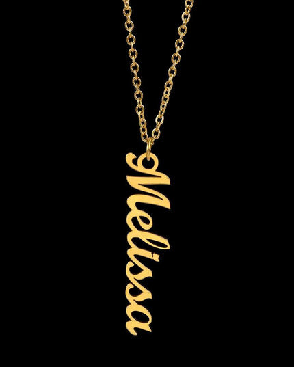 gold vertical name necklace on a black background