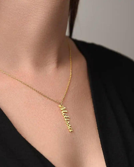 gold vertical name necklace on model's neck