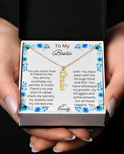 vertical name necklace in standard box with to my bestie message card with gold variant with photo of box in hands