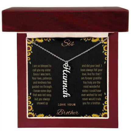 Vertical Name Necklace with a polished stainless-steel charm on a to sis from brother greeting card in a mahogany box