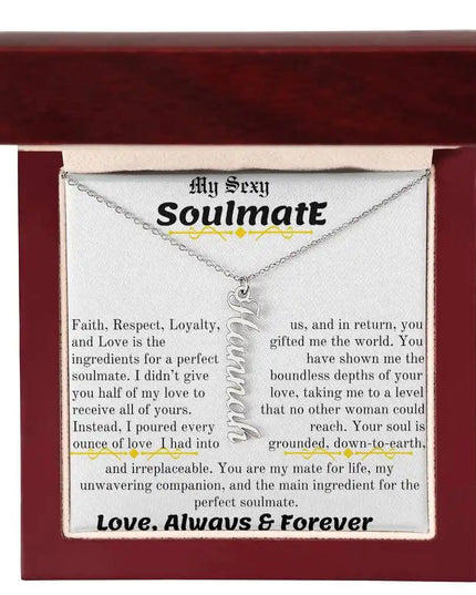 a polished stainless steel vertical name necklace in a mahogany box