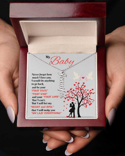 polished stainless-steel vertical name necklace in luxury box in hands