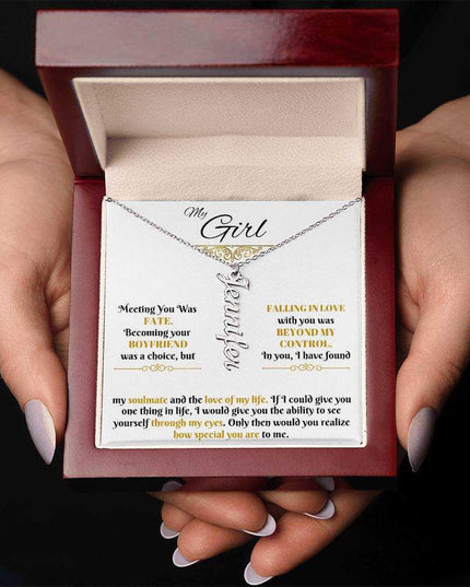 polished stainless-steel vertical name necklace in a luxury box in hands
