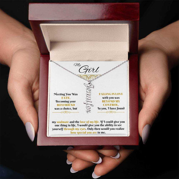 polished stainless-steel vertical name necklace in a luxury box in hands