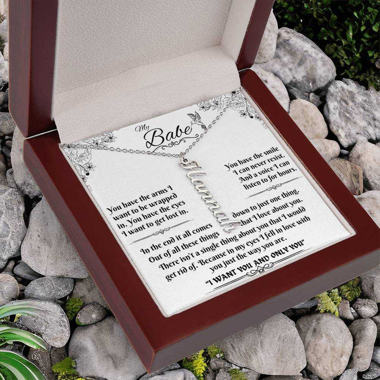 polished stainless-steel vertical name necklace in a luxury box angled left