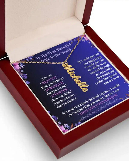 gold vertical name necklace in mahogany box angled left