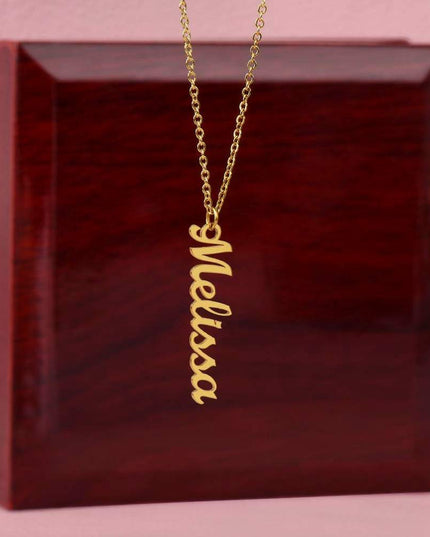 yellow gold vertical name necklace in a closed luxury box upright