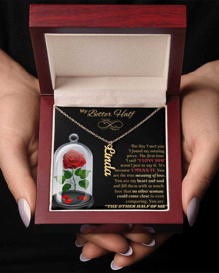 18k gold vertical name necklace in luxury box in model's hands